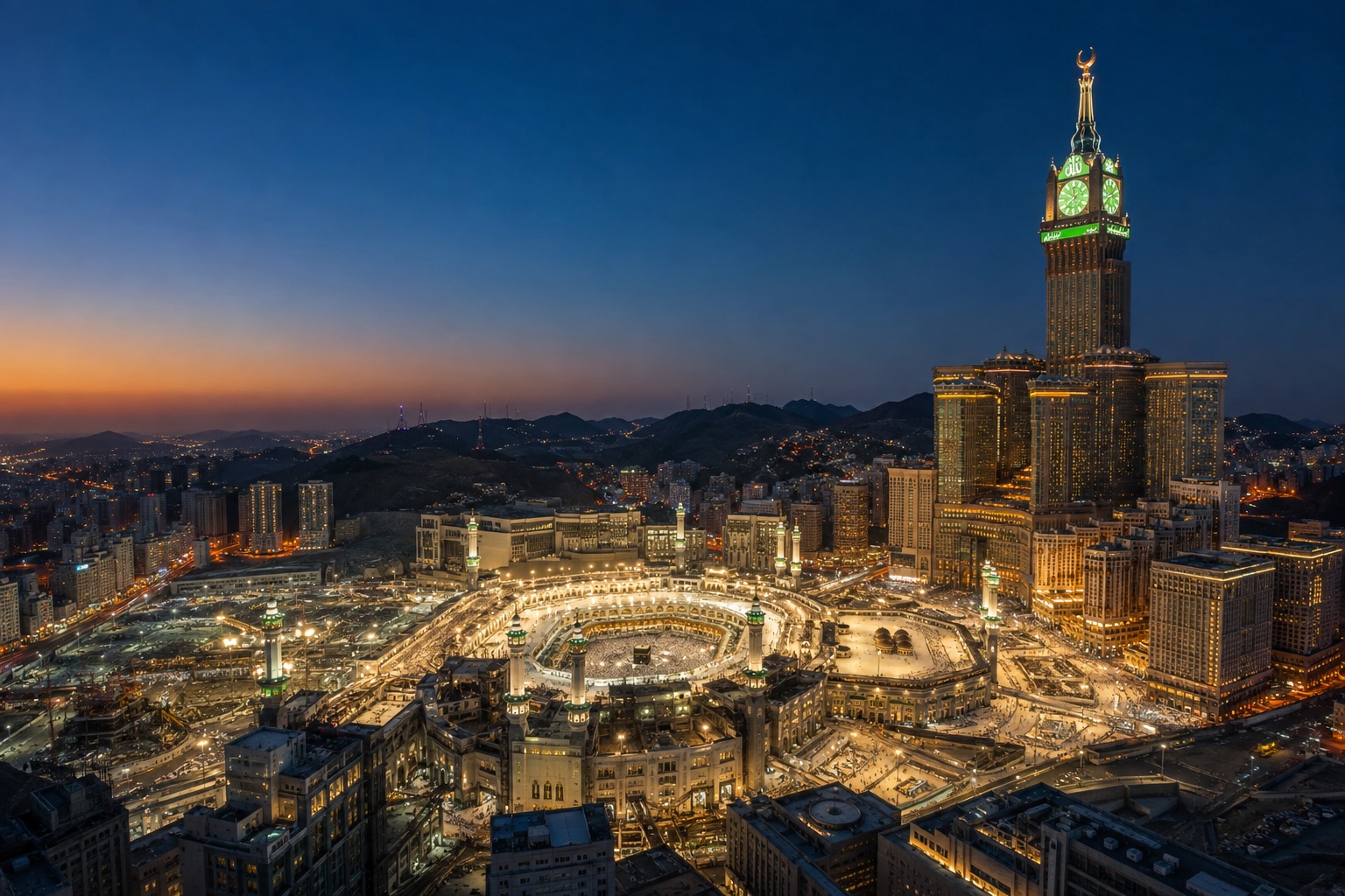 Masjid al-Haram at dusk, with the Abraj Al Bait clock tower and Makkah's hotel districts lit up around the Grand Mosque